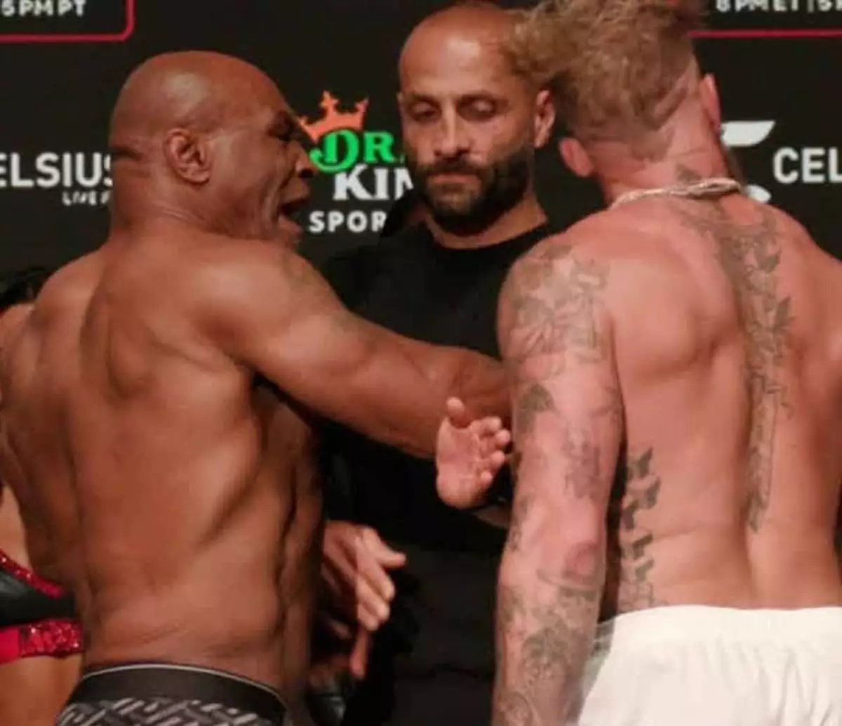 The Clash of Generations: Mike Tyson and Jake Paul Face Off at Weigh-In